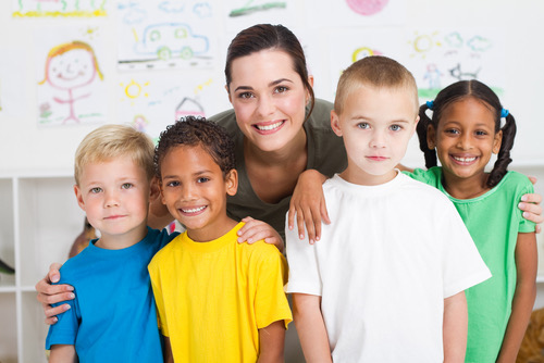 group of preschool kids and teacher in classroom